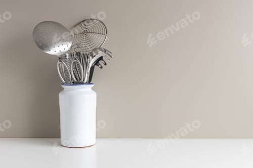 Preview: kitchen utensils in vase on table with copy space for menus and recipes