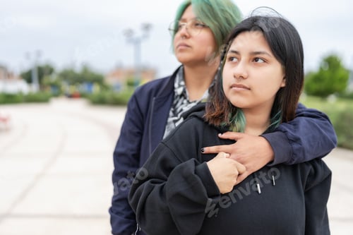 Preview: Lesbian couple embraced in the street