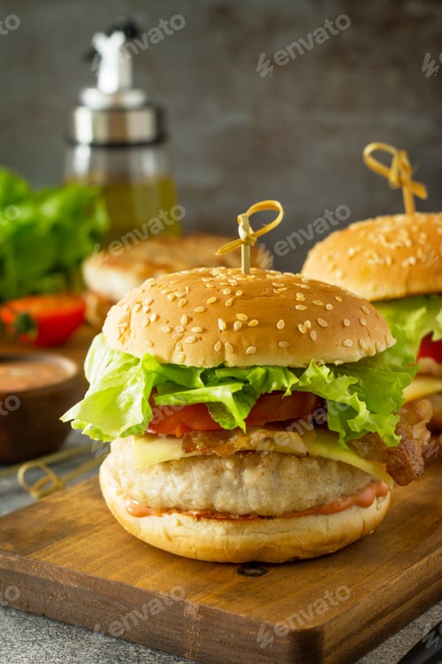 Preview: Delicious grilled burgers, hamburger with cutlet of chicken, cheese and bacon.
