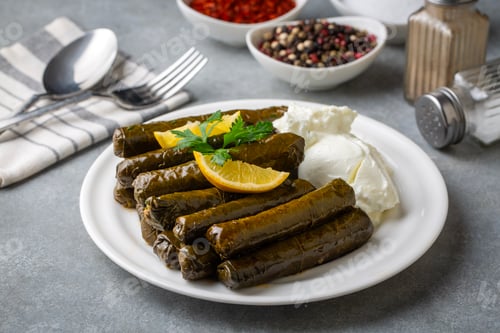 Preview: Turkish cuisine; stuffed grape leaves served with yogurt - Dolmathes , Turkish name; yaprak sarmasi