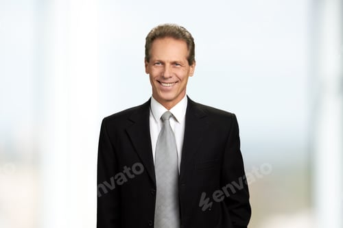 Preview: Cheerful mature businessman, portrait.