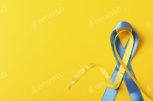 Preview: Support Ukraine concept, blue and yellow awareness ribbons on yellow background