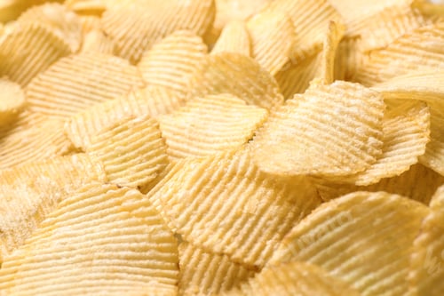 Preview: Pile of crispy potato chips as background, closeup