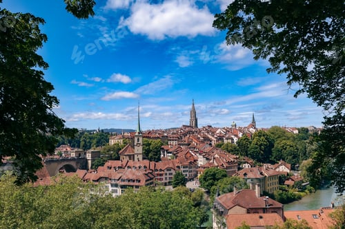 Preview: A panoramic view of Bern, Switzerland showcasing historic architecture and lush greenery