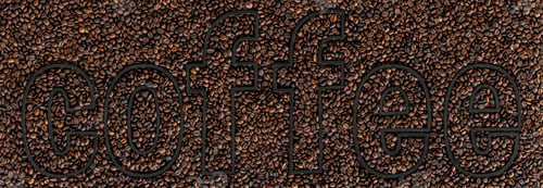 Preview: The word Coffee on a background of coffee beans scattered on the surface.