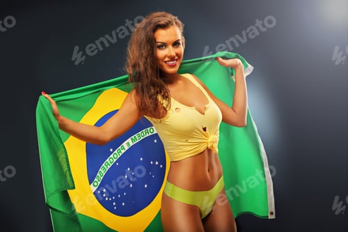 Preview: Happy Brazilian fan cheering with flag