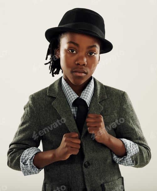 Preview: Dressed in his best. A young boy looking cool in the studio.