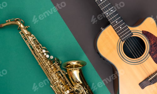 Preview: Guitar and saxophone on paper background, top view.