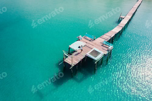 Preview: Wooden bridge at the beach and clear blue water