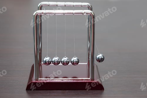 Preview: A system of pendulums demonstrating the law of conservation of energy