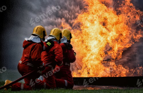 Preview: fire fighter team on training with gas and oil fire hold hose spray jet water spray to extinguish