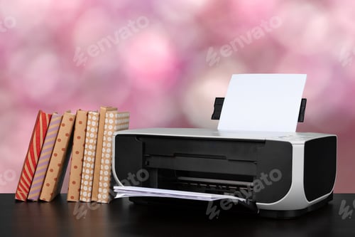 Preview: Compact home printer on desk with books against blurred background