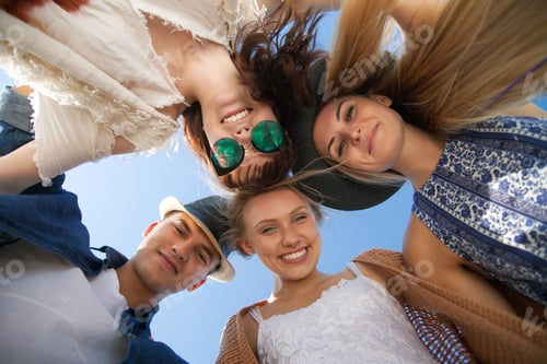 Preview: Group of friends in circle smiling and having fun