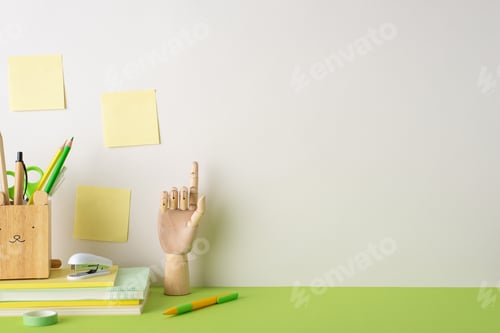 Preview: Motivational desk arrangement. Side view of stationery stand, pencils, pens, adhesive tape, planners