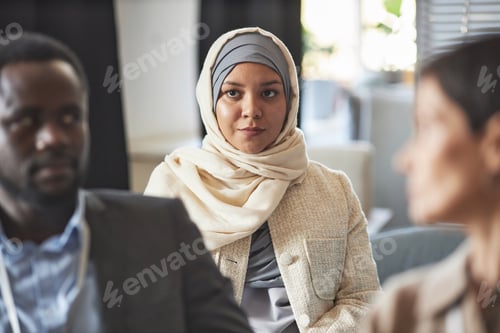 Preview: Business Meeting with Woman Wearing Beige Headscarf