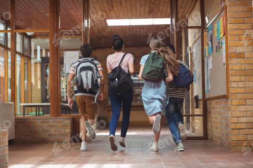 Preview: Excited classmates running in corridor