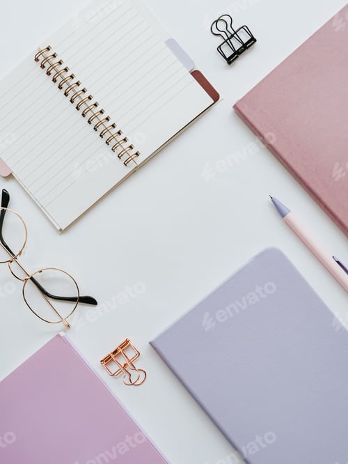 Preview: Colorful home office desk workspace with various notebooks and stationery on white background