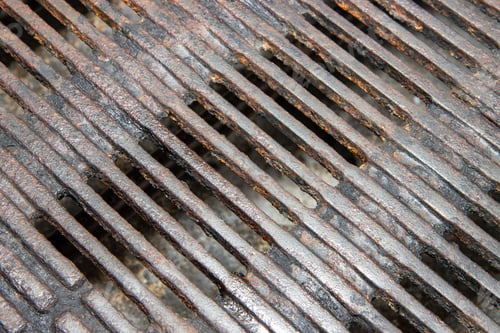 Preview: A Close Up Of A Dirty Metal Barbecue Grill