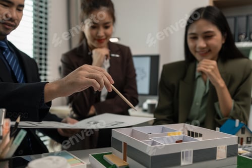 Preview: Architects work with engineers and contractors in the office to check the accuracy of the first draf