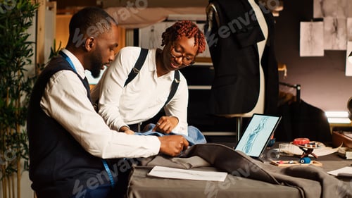 Preview: Tailor and assistant picking fabric