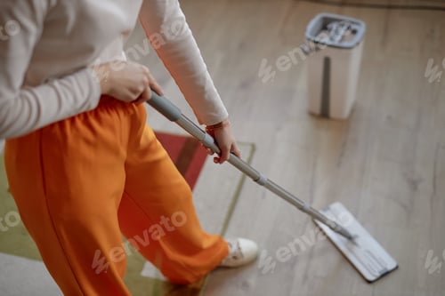Preview: Girl Mopping Floor at Home Doing House Cleaning
