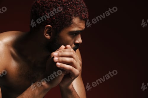 Preview: Black shirtless bearded man posing and looking aside