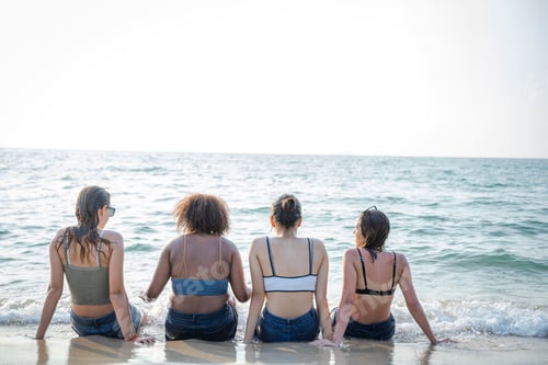 Preview: Young woman playing together on tropical beach at summer,Summer vacation concept.