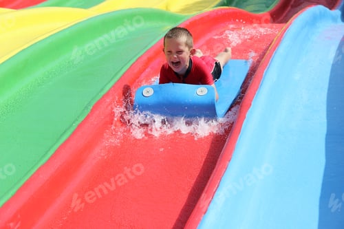 Preview: Boy on a red water slide