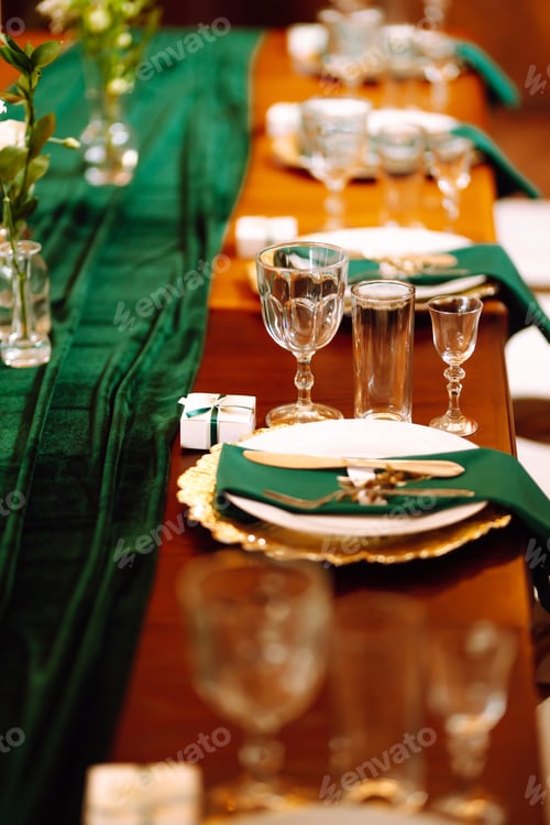 Preview: Banquet table in the restaurant, preparation before the banquet. The work of professional florists.