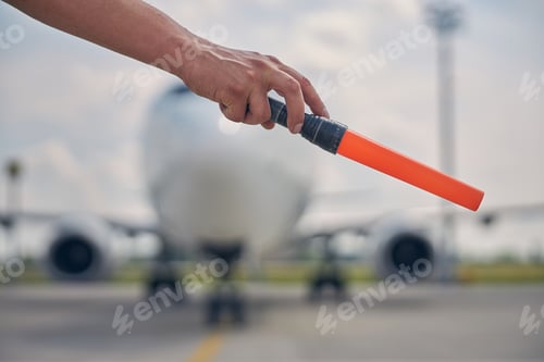 Preview: Man making a signal to the cockpit crew