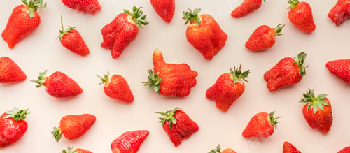 Preview: Fresh strawberries, different in shape and size, flat lay, light beige background, top view banner