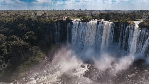 Preview: Kalandula Waterfall cascading beautifully in Angola under a clear sky