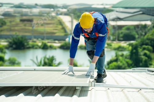 Preview: Engineer service check installation solar cell on the roof of factory.