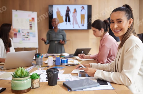 Preview: Reaching for success daily. Shot of a group of businesswoman having a meeting at work.