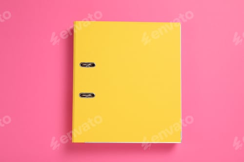 Preview: Yellow office folder on pink background, top view
