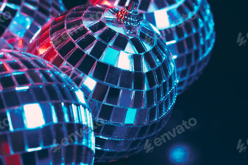 Preview: Group of shiny Disco Balls on dark background close up