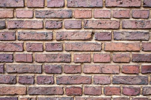 Preview: Wall is made of old durable red brick. Textured background. Copy space.