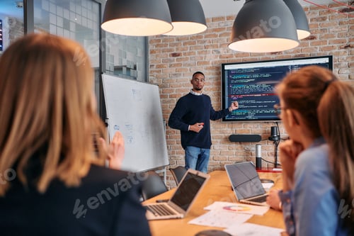 Preview: African-American businessman leads a meeting, passionately presenting a business plan to his