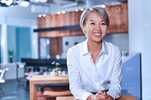 Preview: Portrait of short haired woman looking at camera smiling