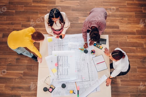Preview: Diverse group of engineers or architects having a meeting in an office