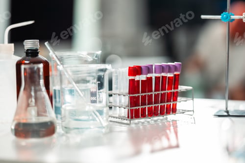 Preview: Scientist conducts a blood test in sterile laboratory setting, carefully placing a blood sample