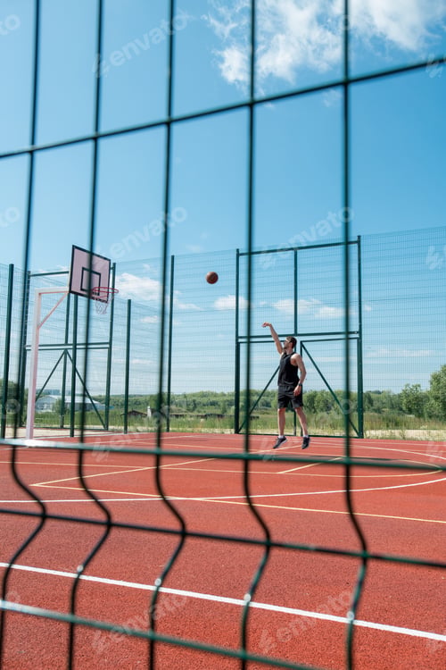 Preview: Man Throwing Ball in Hoop