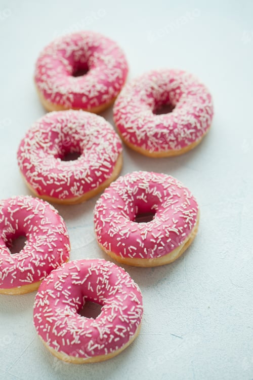 Preview: Bitten donut. Sweet icing sugar food. Dessert colorful snack.