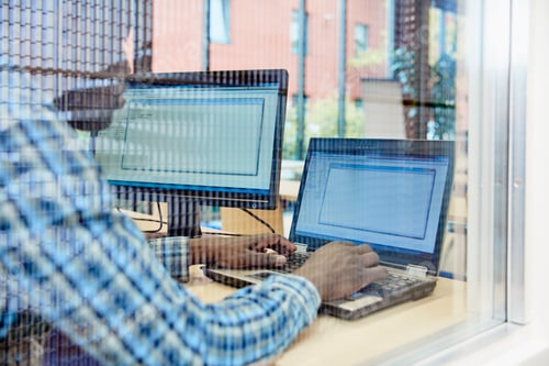 Preview: Man using laptop in office