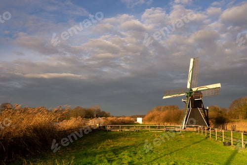 Preview: The Follega windmill under a heavy clouded sky