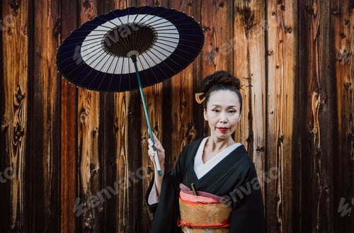 Preview: Beautiful japanese senior woman walking in the village. Typical japanese traditional lifestyle