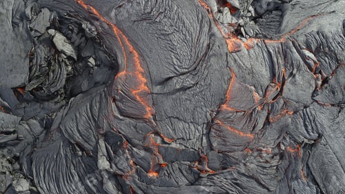 Preview: Volcanic eruption with glowing orange lava flow surrounded by a pool of bubbling magma