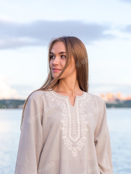 Preview: portrait of a young beautiful girl with long hair in a light dress