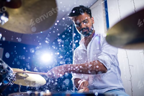 Preview: indian man playing the drums sticks close-up in recording studio