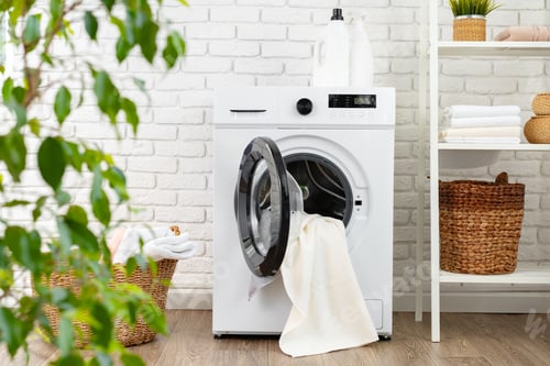 Preview: Detergent bottle on washing machine in a laundry room